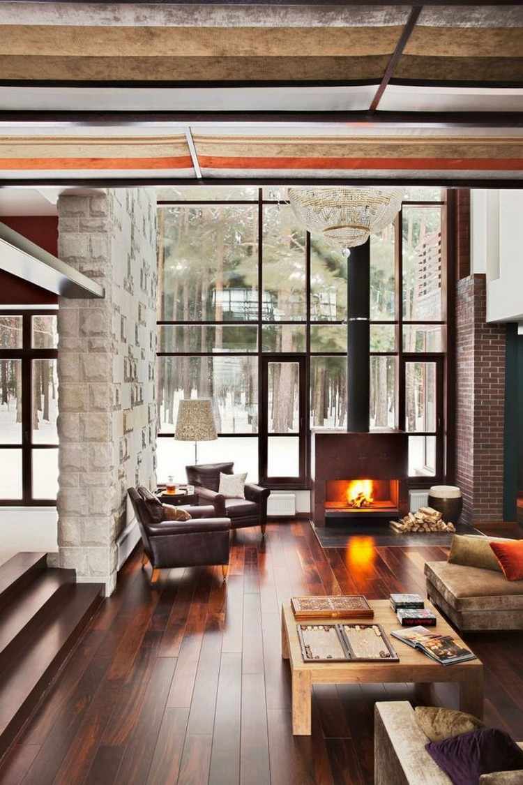 تصميم-أفكار-غرفة معيشة-نمط ريفي-أرضيات خشبية-واجهة زجاجية-موقد حرق الخشب