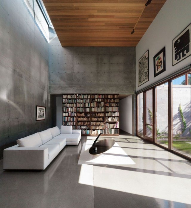 منزل بجدران خرسانية أريكة سقف زجاجية ذات تأثير خشن