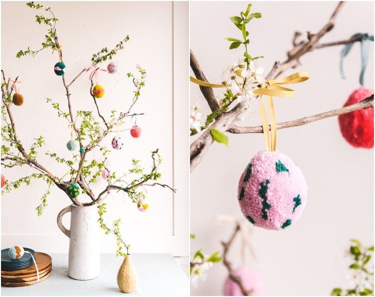 الديكور مع فروع لشجرة الربيع مع بيض عيد الفصح مزركشة في إناء