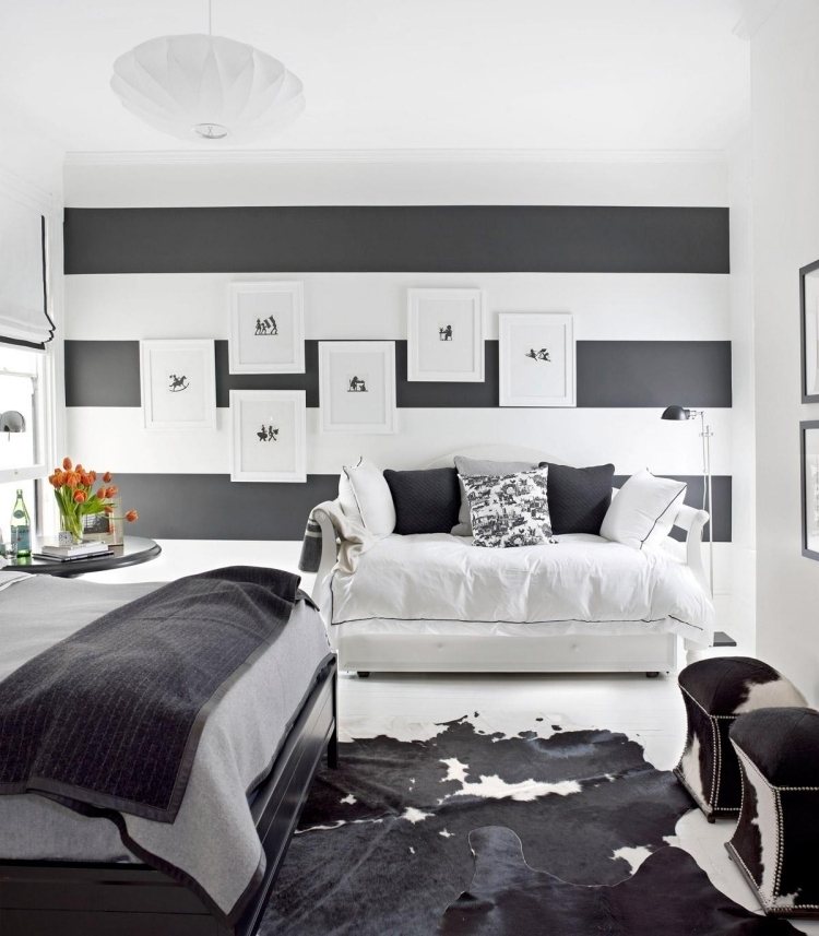 تصميم حائط-أسود-أبيض-غرفة نوم-أريكة-صور-خطوط-فرو-سجادة