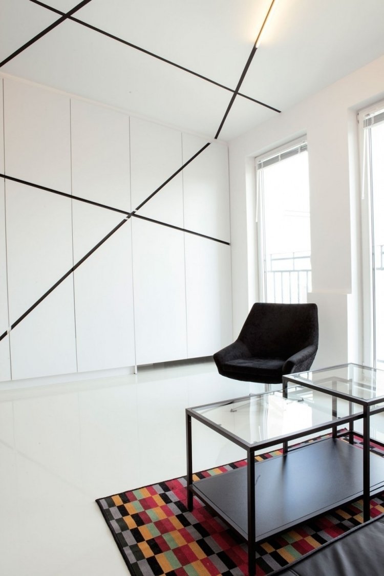 تصميم حائط - أسود - أبيض - غرفة معيشة - دولاب - دولاب - خطوط سقف - سجاد - ملون - كرسي بذراعين