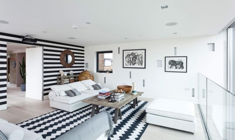 تصميم حائط باللونين الأبيض والأسود - غرفة المعيشة - خطوط - خطوط متعرجة - جلوس - أثاث - صور - طاولة خشبية