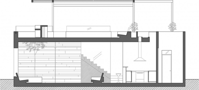 تصميم منزل سكني في الطابق الأرضي من كازا سيتا مع شرفة على السطح