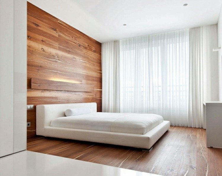 تصميم ارضيات خشبية من مافي سرير ابيض لغرف النوم