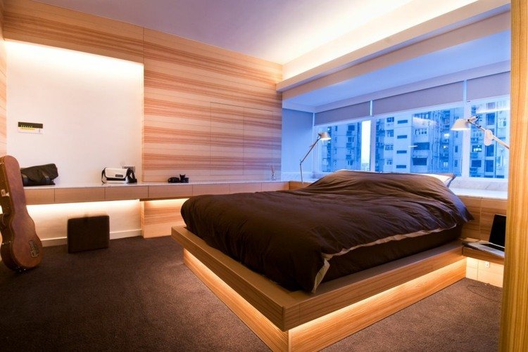 إضاءة غير مباشرة لغرفة النوم فكرة خشبية تغطي الجيتار